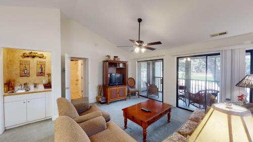 a living room with a couch and a table at Pawleys Plantation Greens 1 Bedroom Retreat in Pawleys Island
