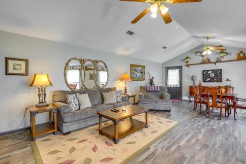 a living room with a couch and a table at Buckhead Cabin with Fireplaces and Private Pool! in Eatonton 