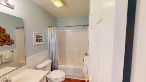 a bathroom with a shower and a toilet and a sink at True Blue Villas Your 3BR Oasis in Pawleys Island