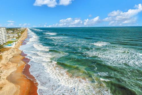 a view of the ocean from the shore of a beach at Sand and Sea Enjoyment Retreat in Ormond Beach