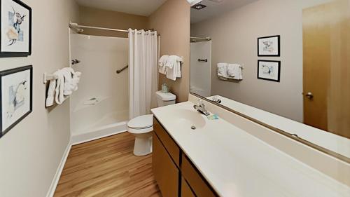 a bathroom with a sink and a toilet and a shower at Scenic Golf Villa River Club 2BR Getaway in Pawleys Island