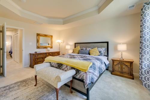 una camera da letto con un letto e una sedia di Spacious Hedgesville Retreat about 5 Mi to Golf Course a Hedgesville