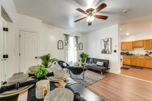 a living room with a couch and a ceiling fan at Allentown Vacation Rental - Walk Downtown! in Allentown