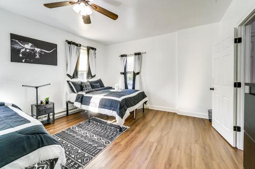 a bedroom with two beds and a ceiling fan at Allentown Vacation Rental - Walk Downtown! in Allentown
