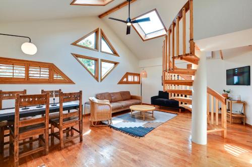 a living room with vaulted ceilings and skylights at Pet-Friendly Flagstaff Studio Cabin with Patio in Flagstaff