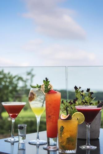 a group of different types of drinks on a table at The Peacock at Barlow in Chesterfield