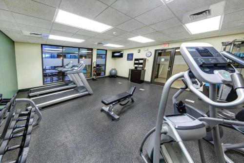 a gym with treadmills and machines in a room at Hampton Inn & Suites Chadds Ford in Glen Mills