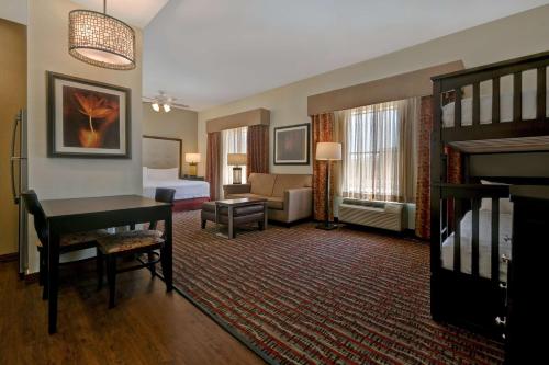 a hotel room with a bed and a desk at Homewood Suites by Hilton Denver Tech Center in Englewood