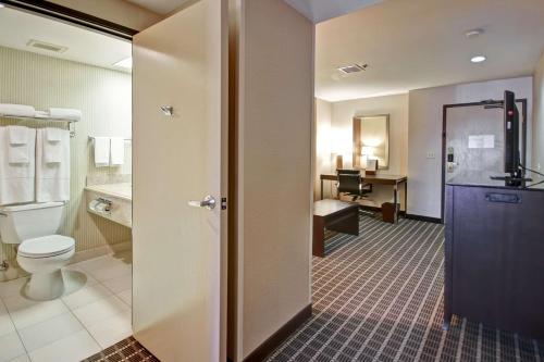a bathroom with a toilet and a sink at DoubleTree by Hilton Hotel Flagstaff in Flagstaff