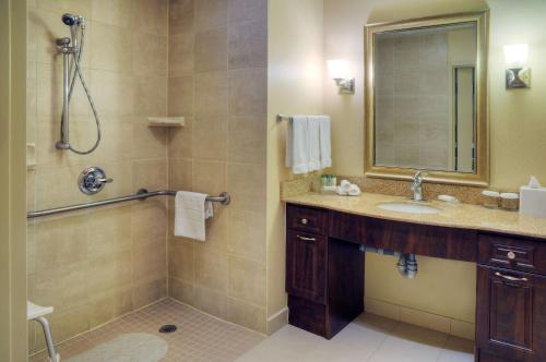 a bathroom with a sink and a shower at Homewood Suites by Hilton Burlington in Burlington