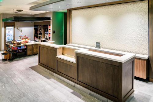 a large kitchen with a counter in a room at Hilton Garden Inn Santa Barbara/Goleta in Santa Barbara