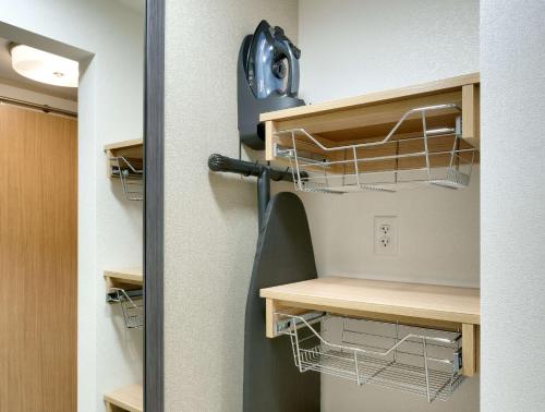 a closet with a hair dryer on the wall at Hilton Garden Inn Lehi in Lehi