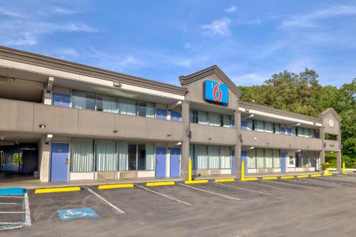 a building with a number sign in a parking lot at Motel 6 Morgantown in Morgantown