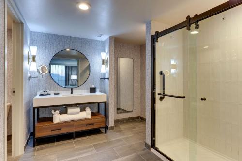 a bathroom with a sink and a mirror at The Chattanoogan Hotel, Curio Collection By Hilton in Chattanooga