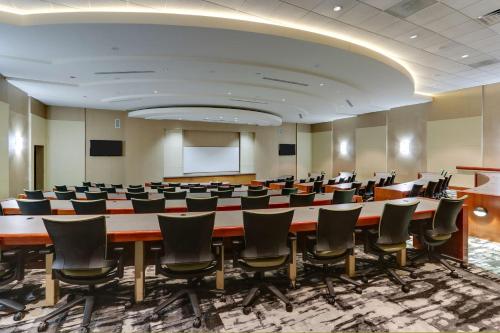 a large conference room with a large table and chairs at The Chattanoogan Hotel, Curio Collection By Hilton in Chattanooga