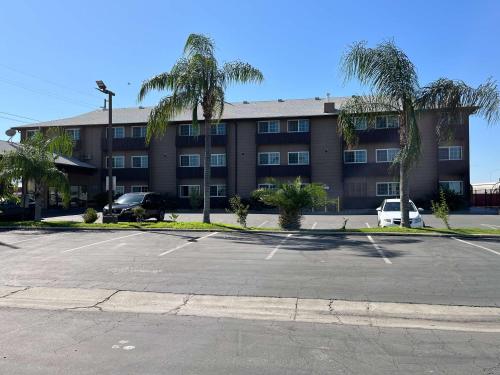 an empty parking lot in front of a building at Studio 6 Suites Delano, CA in Delano