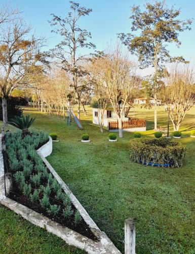 a park with a path in the grass at Samuel santos in Araucária