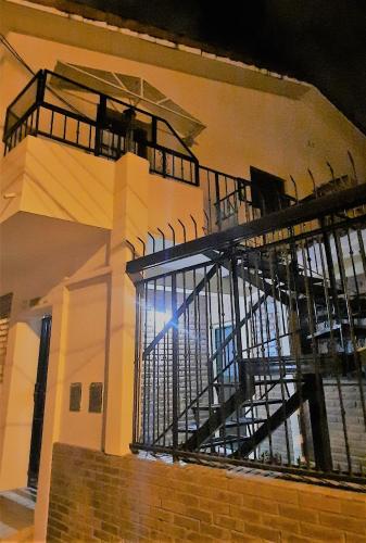 a building with a staircase on the side of it at Departamento Laprida en Salta, Argentina in Salta