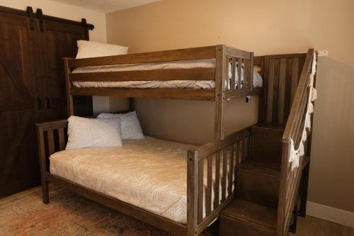 a couple of bunk beds in a room at Feel at Home a 3 Minute Walk from the Beach in Myrtle Beach