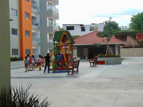 a group of children playing in a playground at AM.AIRBNB in Santo Domingo