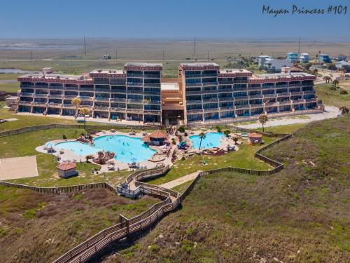 an aerial view of a hotel with two pools at Mayan Princess 101 Beachfront Resort in Port Aransas