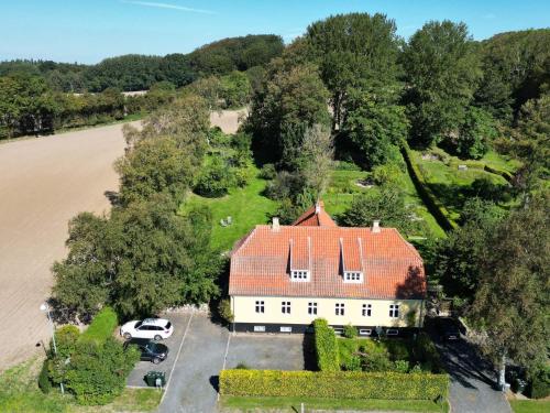 an aerial view of a white house with a red roof at 7 person holiday home in Tranekær-By Traum in Tranekær