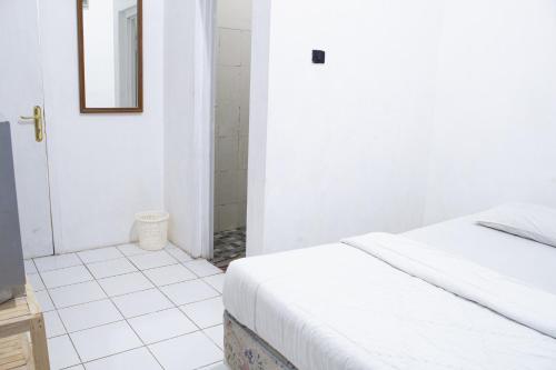 Una cama o camas en una habitación de PUTRAJAYA HOTEL