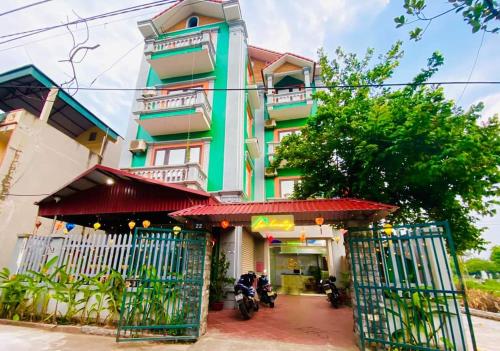 a building with motorcycles parked in front of it at Lion Homestay in Ninh Binh