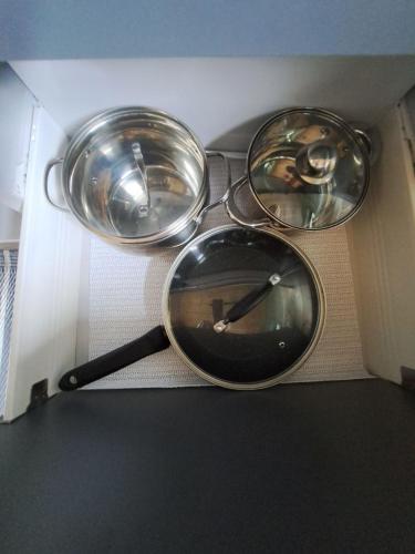 three pans sitting on top of a box at Rest гори 360 чан форель харчування in Sheshory