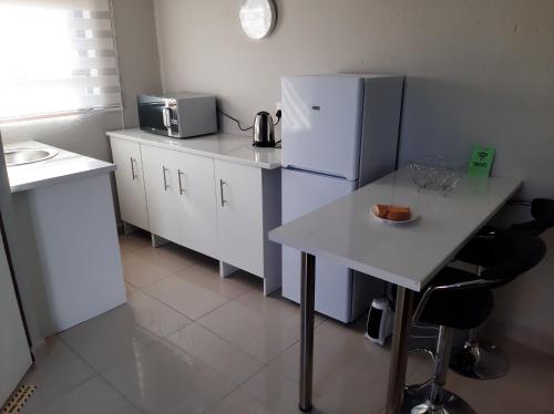 Kuchyň nebo kuchyňský kout v ubytování Bonfai Residence