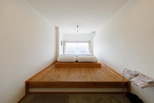 Ένα ή περισσότερα κρεβάτια σε δωμάτιο στο Chus