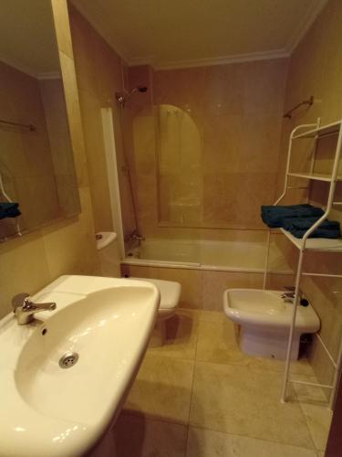 a bathroom with a sink and a toilet and a shower at Apartment with parking "Hola Oviedo" in Oviedo