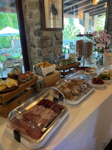 a buffet with many different types of food on a table at Hotel Conti Formentini in San Floriano del Cóllio