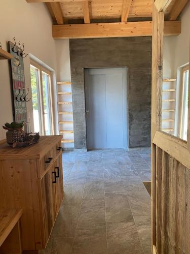 a room with a door and a tile floor at Sunside Apartment in Zell am Ziller