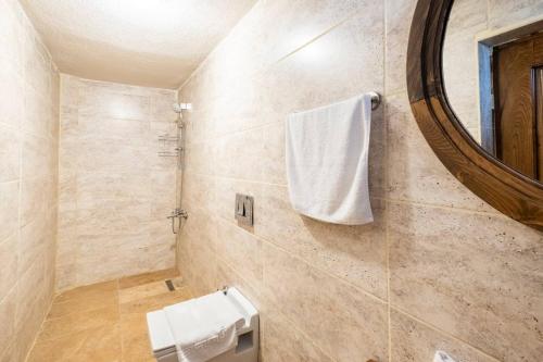 a bathroom with a sink and a mirror at Castle Panorama House in Nevsehir