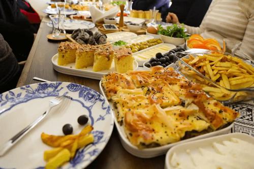a long table with plates of food on it at Castle Panorama House in Nevsehir