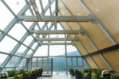 a room with chairs and a large glass ceiling at Windmill Upon Hills Premium Suite By Rapi Stay in Genting Highlands