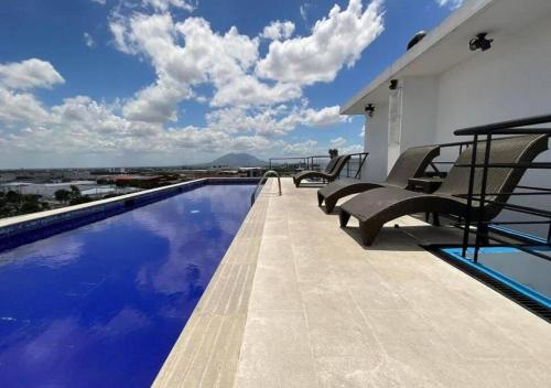 a swimming pool on the roof of a house at Perfectly Located 1 Bed Condo in Angeles