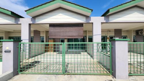 a gate in front of a building at Homestay LK in Sitiawan