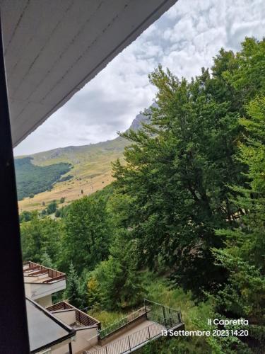 a view of a mountain from a window at La Tana del Capriolo in Prati di Tivo