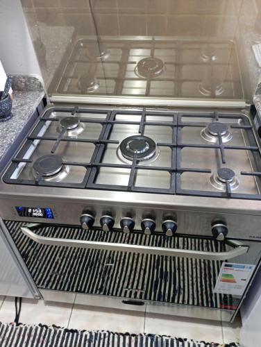 a stove top oven sitting in a kitchen at Holiday Inn fayoum in Kafr Maḩfūz̧