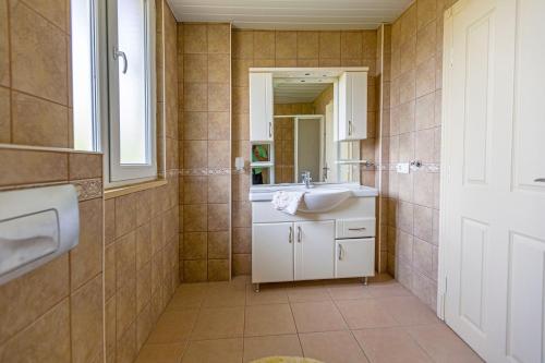 a bathroom with a sink and a mirror at Paradise Town Villa Abel 100 MBPS free wifi in Belek