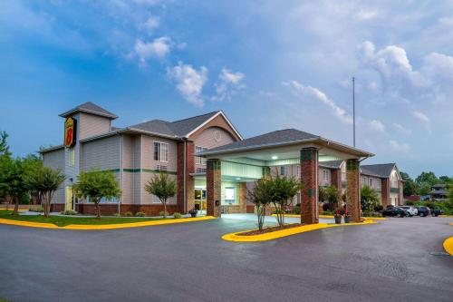 a hotel with a parking lot in front of it at Super 8 by Wyndham Salisbury in Salisbury