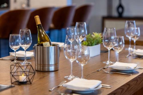 a table with glasses and a bottle of wine on it at DoubleTree by Hilton Las Vegas East Flamingo in Las Vegas