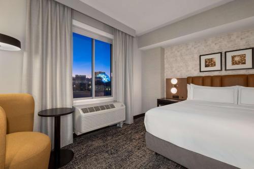 a hotel room with a bed and a window at DoubleTree by Hilton Las Vegas East Flamingo in Las Vegas