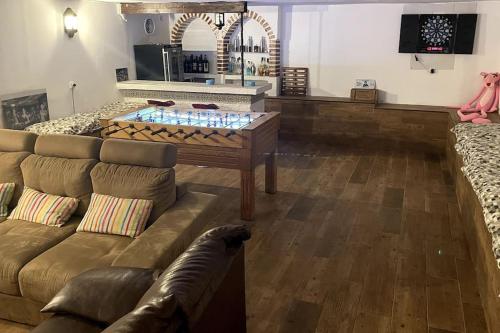 a living room with a couch and a table at Málaga casa grande familiar in Málaga