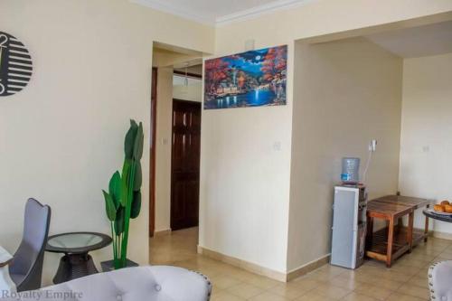 TV o dispositivi per l'intrattenimento presso Lux Suites Impala Apartments Nyali