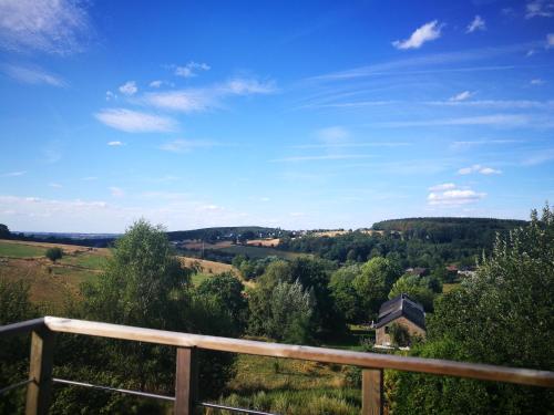 a view of the countryside from the balcony of a house at Un brin de Paradis "appartement de 100 m²" in Harzé
