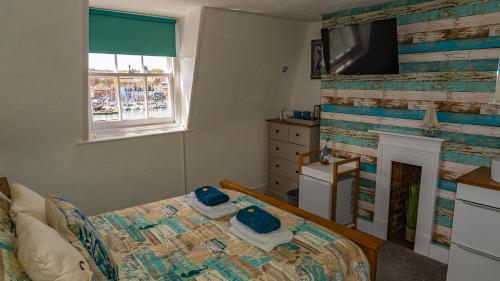 Ένα ή περισσότερα κρεβάτια σε δωμάτιο στο Seacrest Guest House
