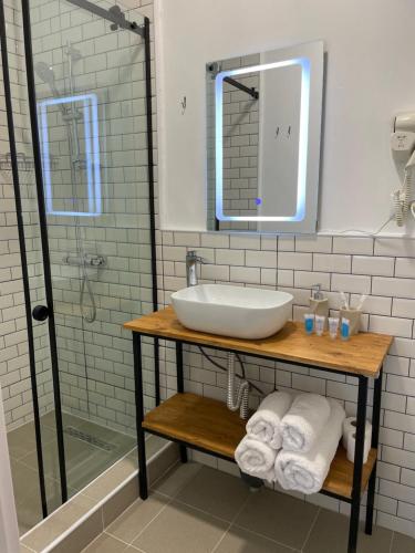 a bathroom with a sink and a shower at Friendly Home in Tʼelavi